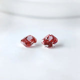 Two fancy vivid pink cushion lab diamonds side by side