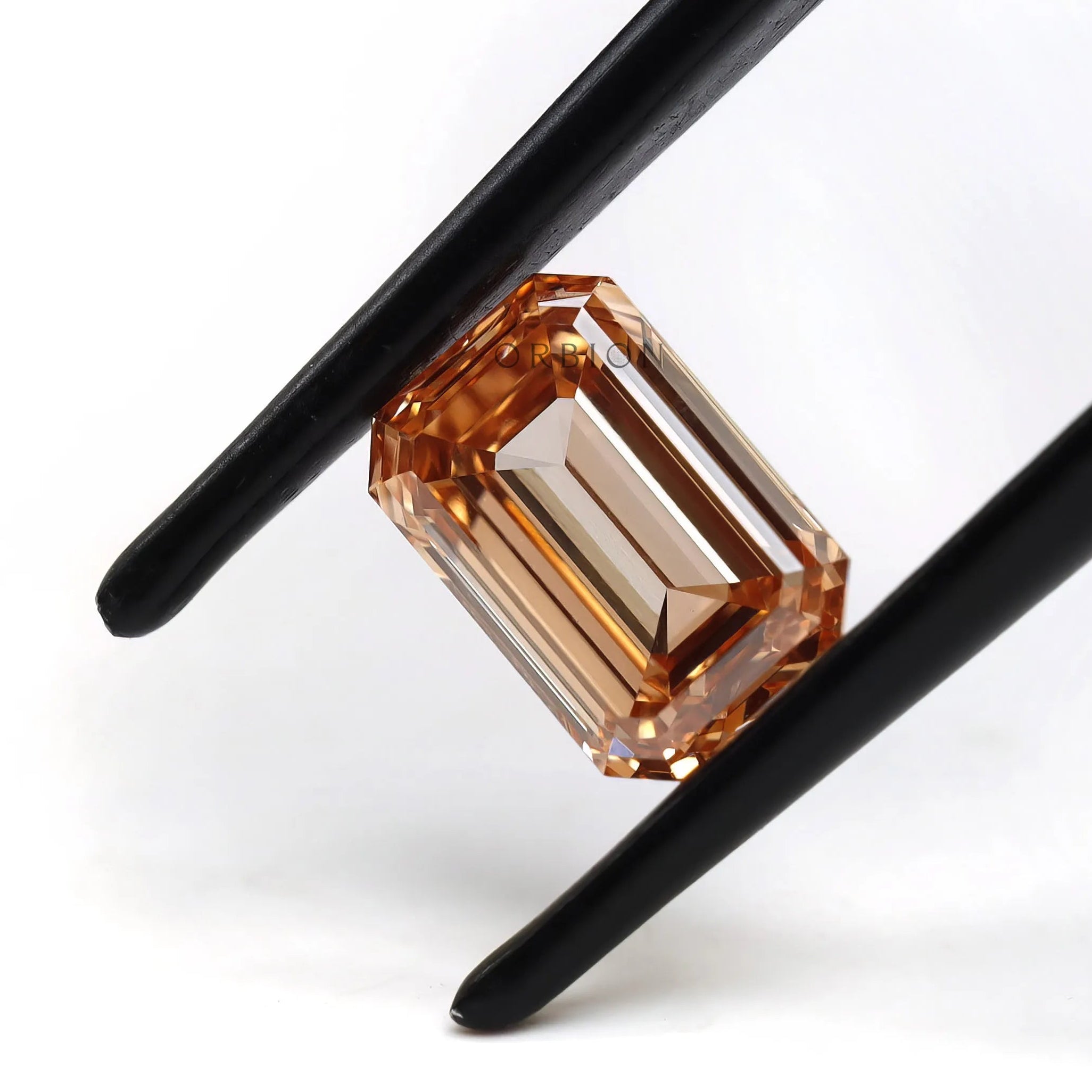 Horizontal view of fancy orange emerald lab diamond