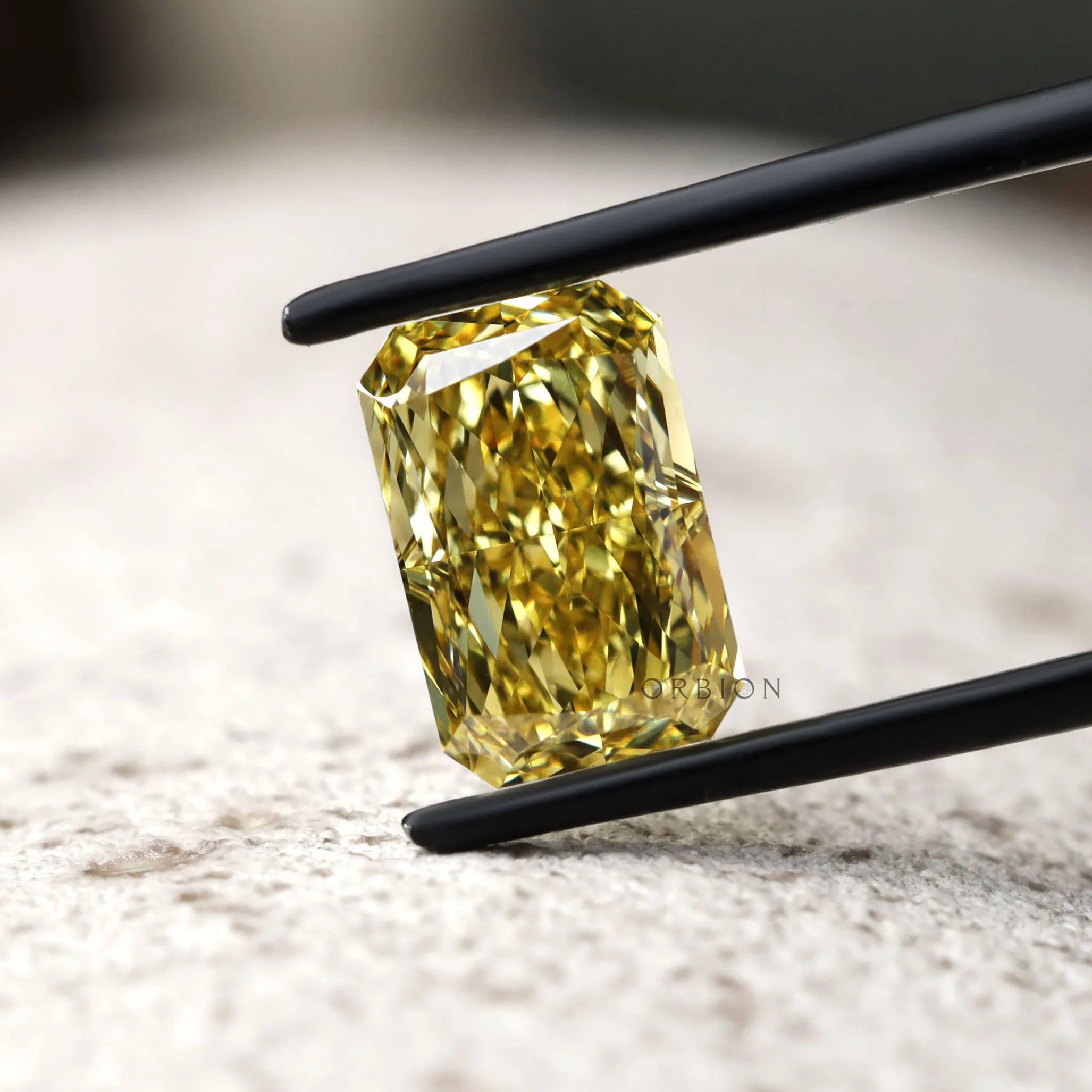 Golden yellow radiant cut loose diamond close view