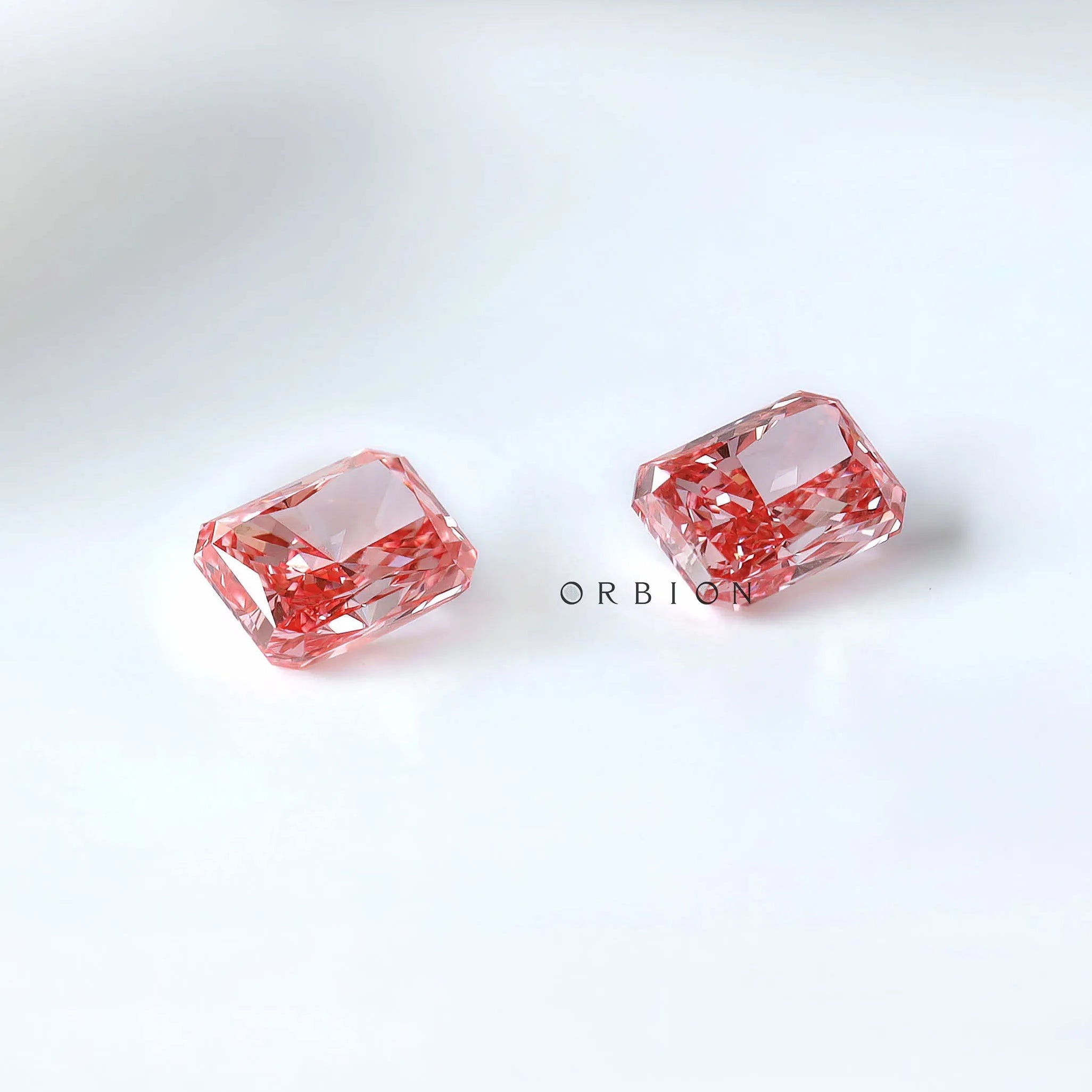 Two radiant vivid pink lab diamonds placed together