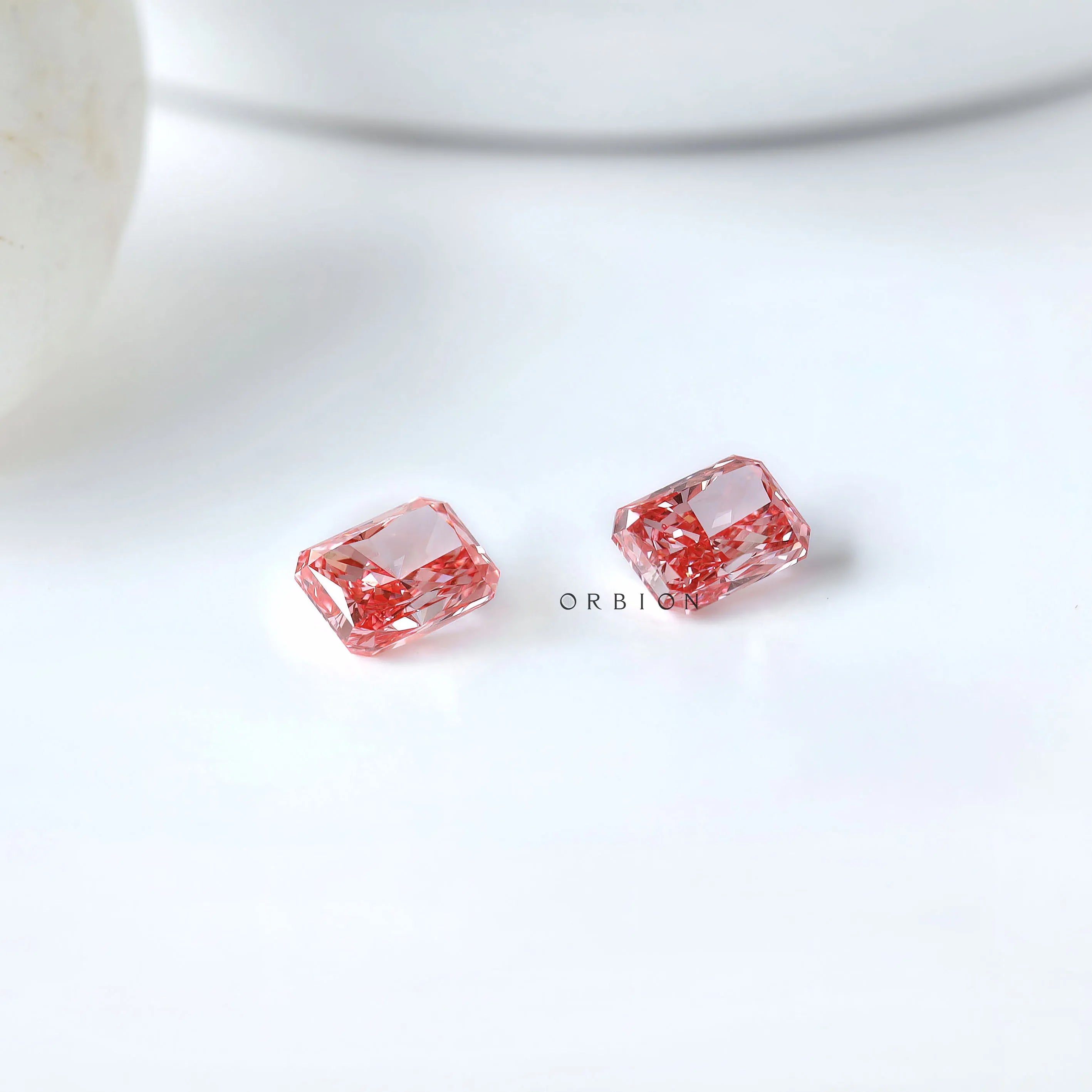Two radiant vivid pink lab diamonds placed together