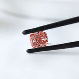 Side angled view of pink cushion modified lab diamond