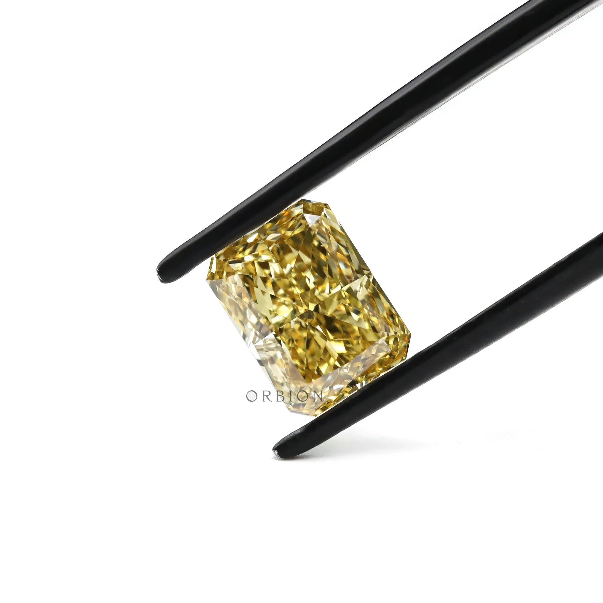 Radiant fancy yellow loose lab diamond face-up isolated view