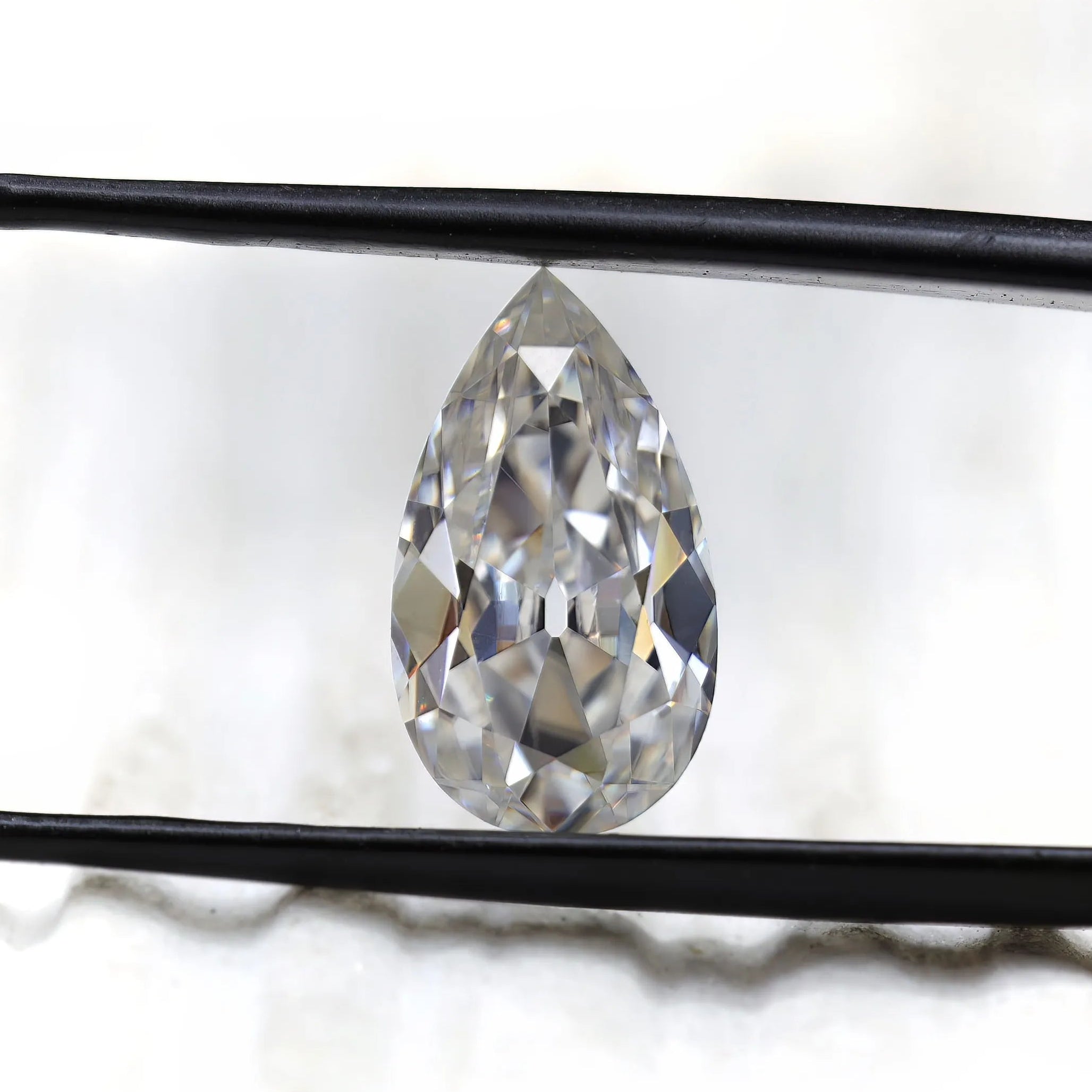 Front facing pear loose moissanite with antique faceting