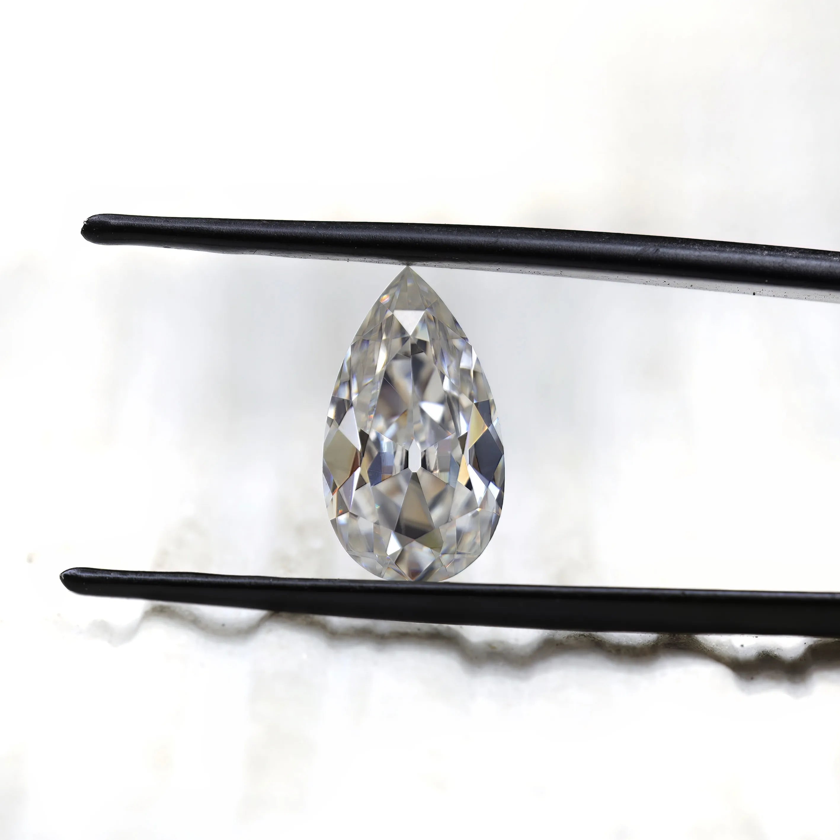 Front facing pear loose moissanite with antique faceting