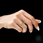 Close hand view champagne moissanite double shank bezel ring gold