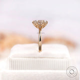 Side profile of elongated cushion moissanite ring on stand