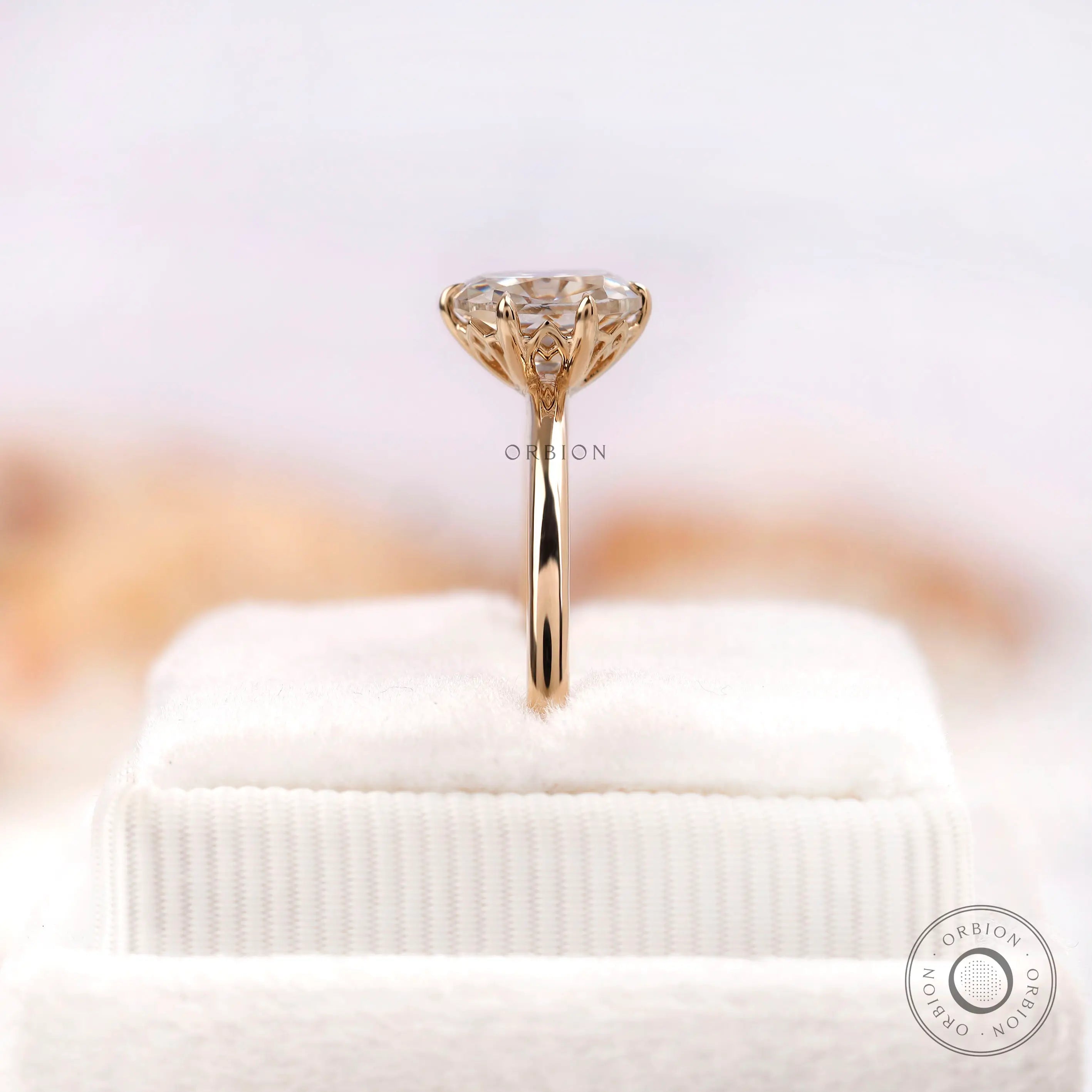 Side profile of elongated cushion moissanite ring on stand