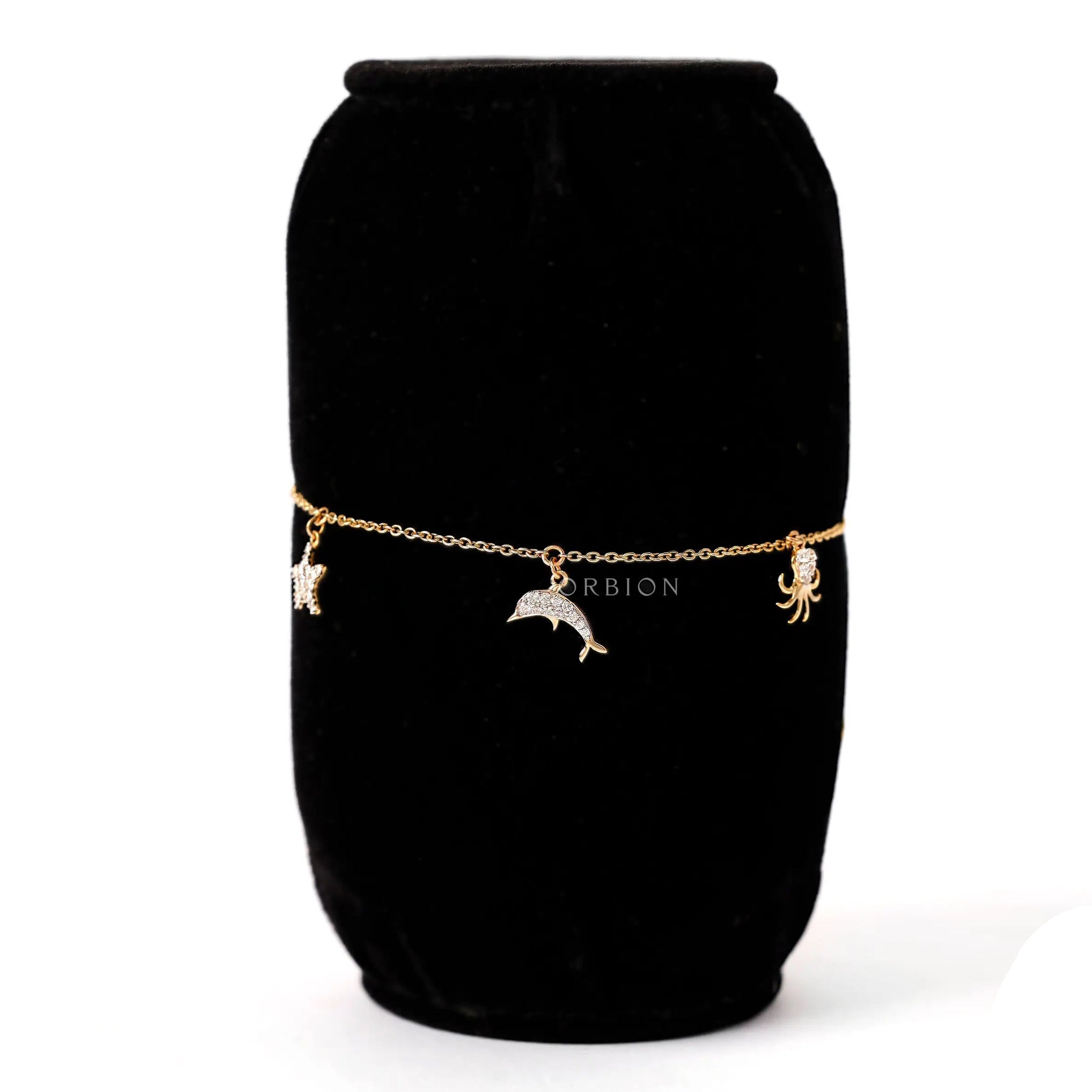 Charm detail view dolphin octopus bracelet in yellow gold