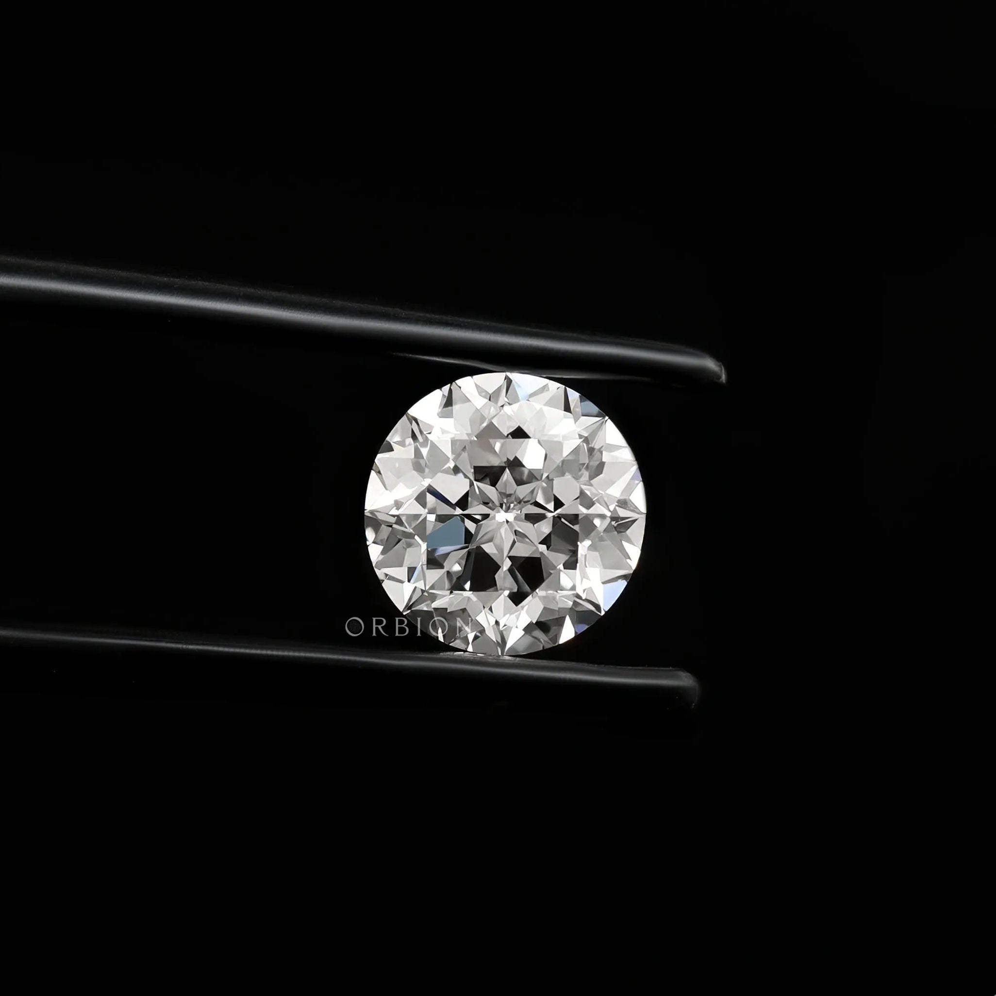 Bright round nova cut lab diamond shown in side angled tweezers view