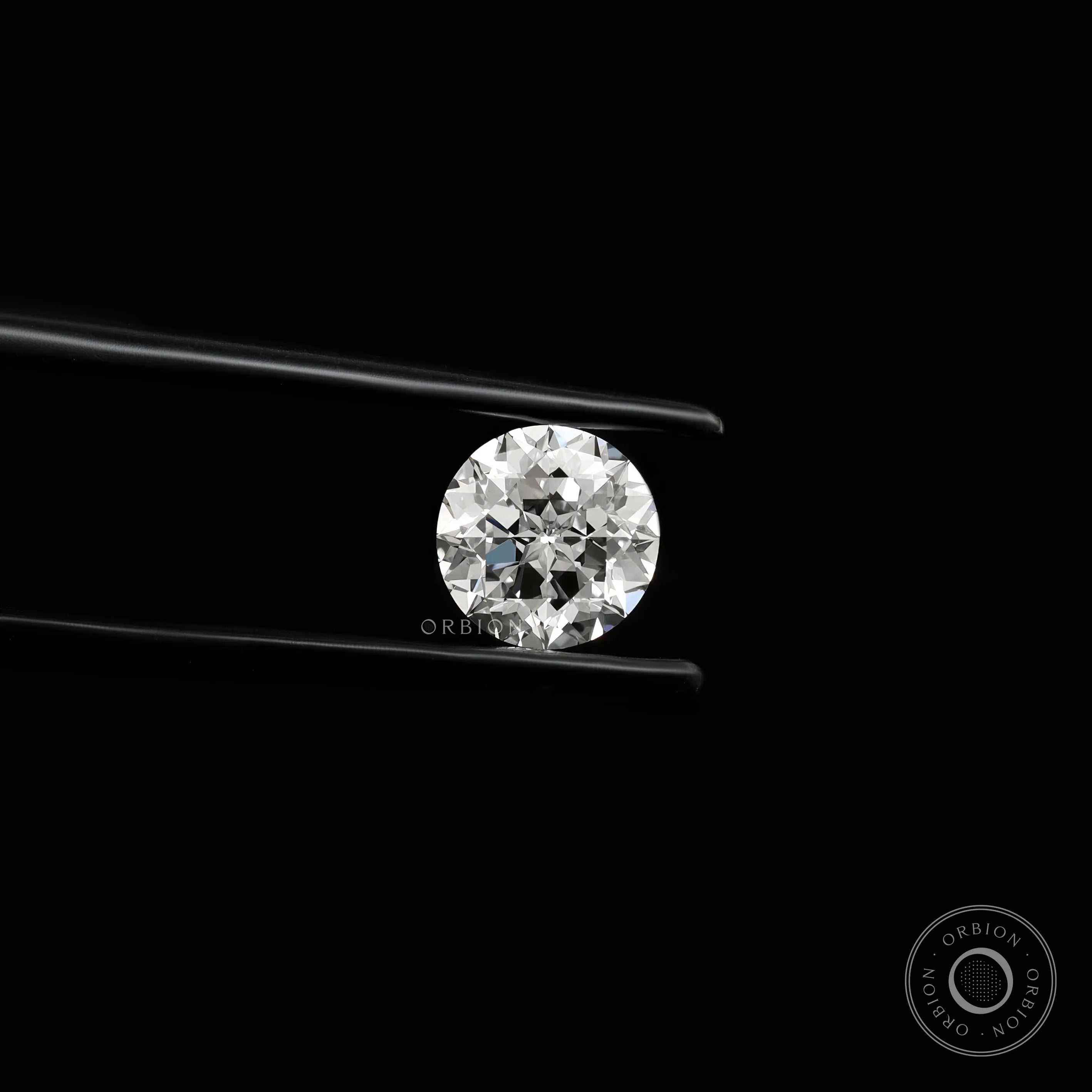 Bright round nova cut lab diamond shown in side angled tweezers view