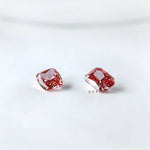 Angled pair view of vivid pink cushion loose diamonds