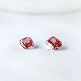 Angled pair view of vivid pink cushion loose diamonds