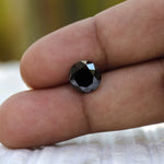 2 CT Old European Cut Black Moissanite in hand
