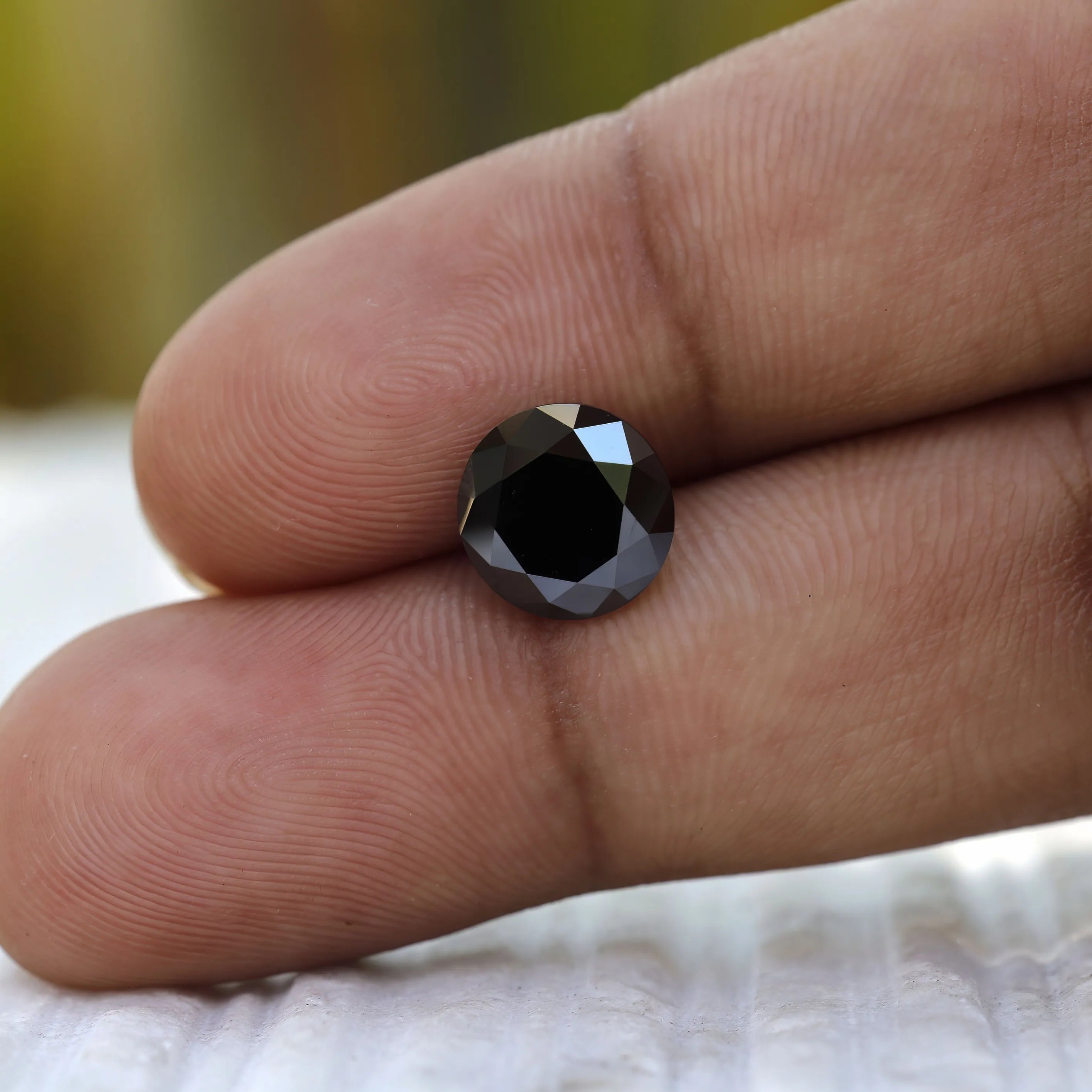 2 CT Old European Cut Black Moissanite in hand