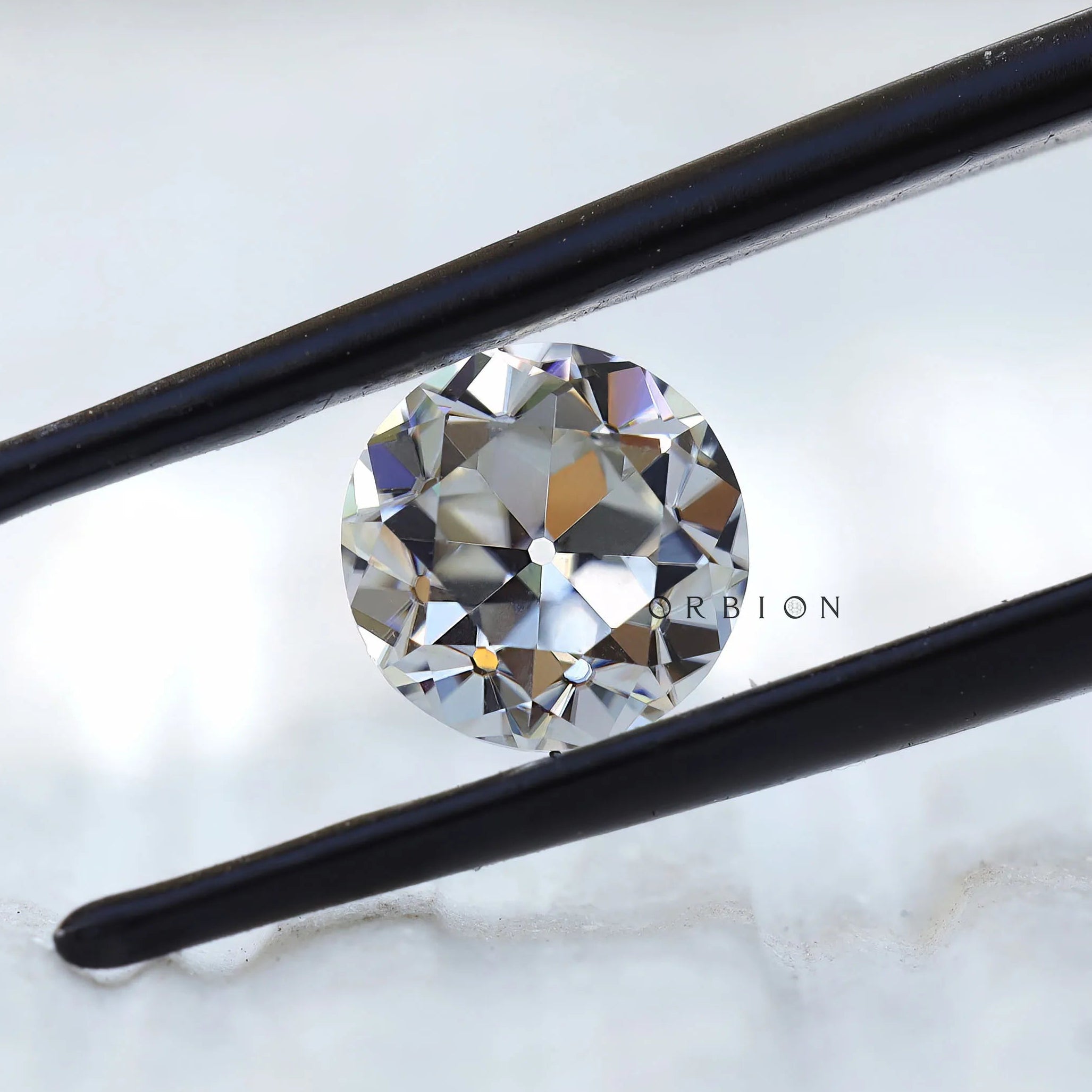 Classic round moissanite with old European cut facet pattern