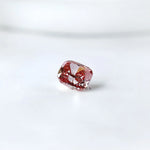 Side profile of purplish pink cushion loose lab diamond
