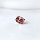 Side profile of purplish pink cushion loose lab diamond
