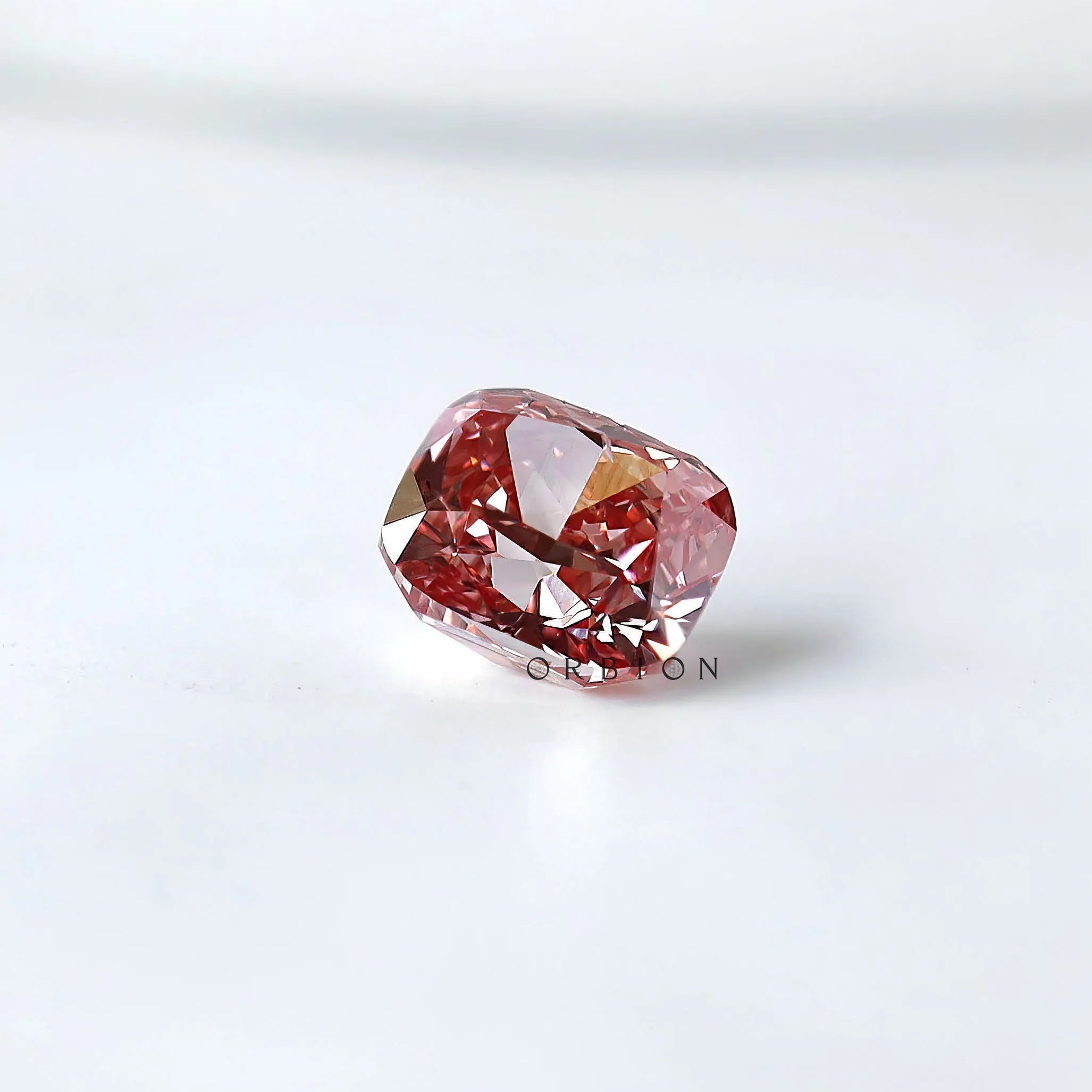 Side profile of purplish pink cushion loose lab diamond