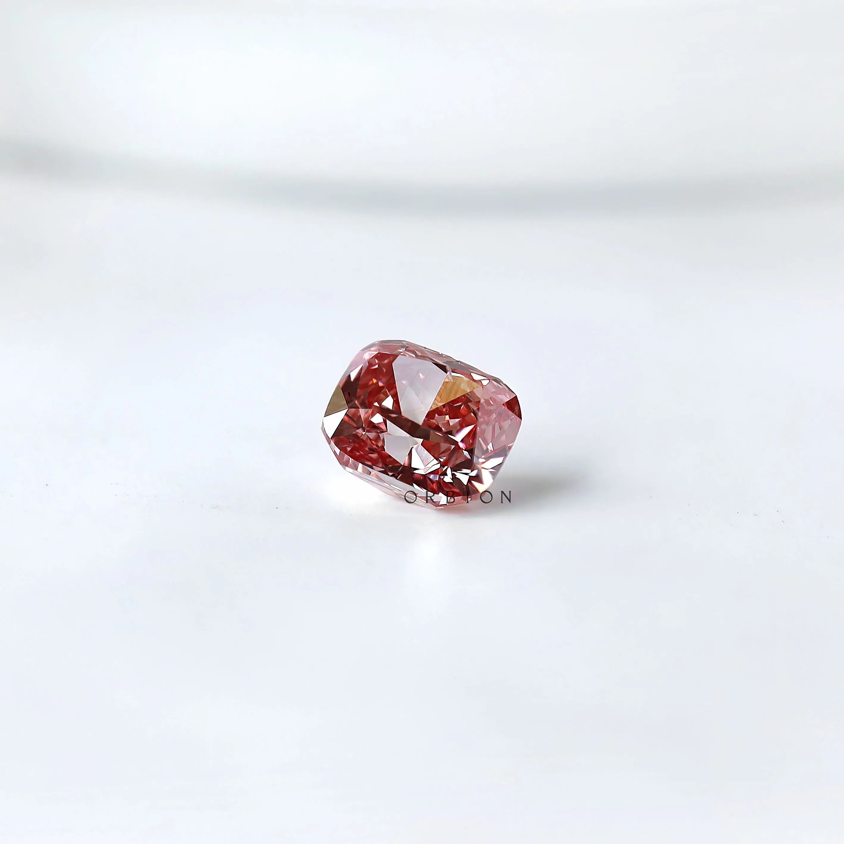 Side profile of purplish pink cushion loose lab diamond