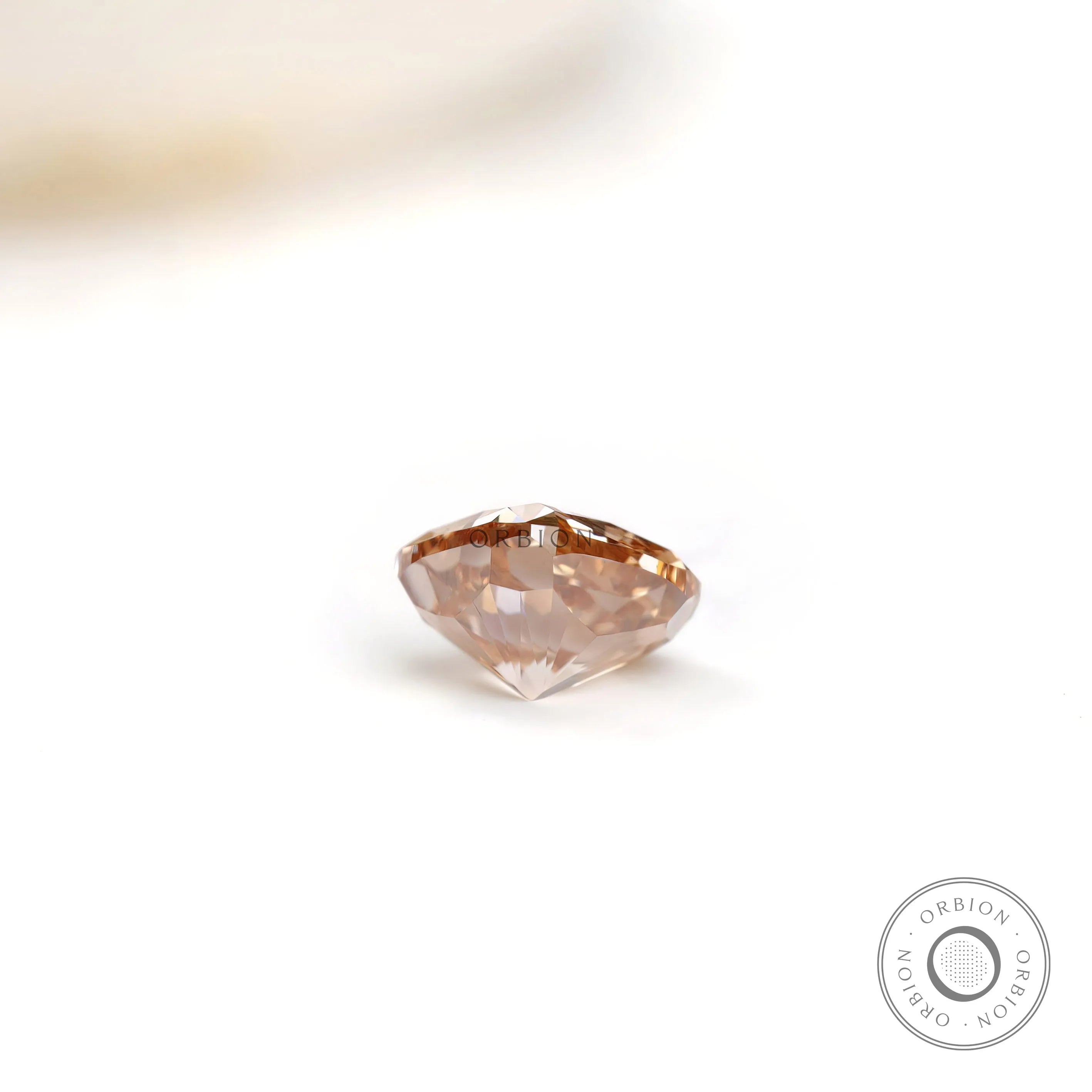 Side profile of fancy orange cushion brilliant lab diamond
