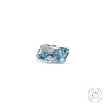 Blue radiant lab diamond resting in horizontal side view