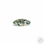 Marquise green lab diamond lying flat on white background