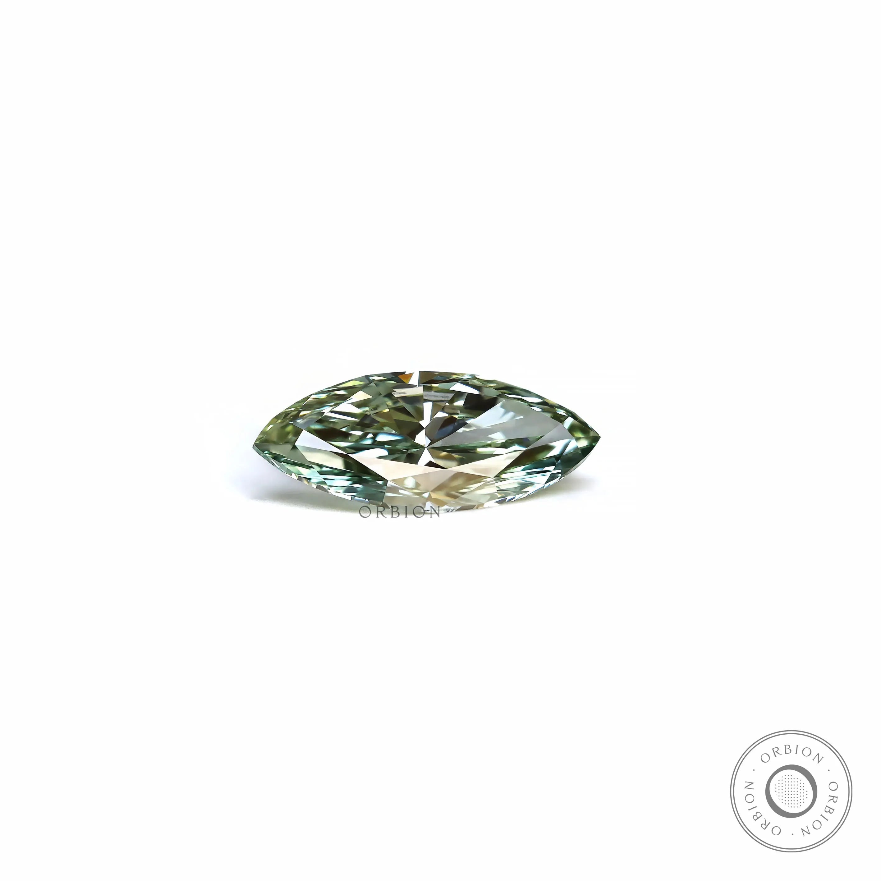 Marquise green lab diamond lying flat on white background