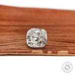 Side profile cushion brilliant cut loose moissanite on wood