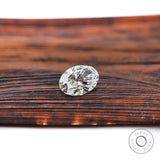 Side view of oval lab diamond with pointed tweezers