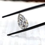 DEF pear moissanite shown at slight side angle