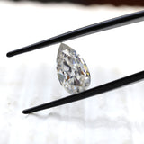 DEF pear moissanite shown at slight side angle