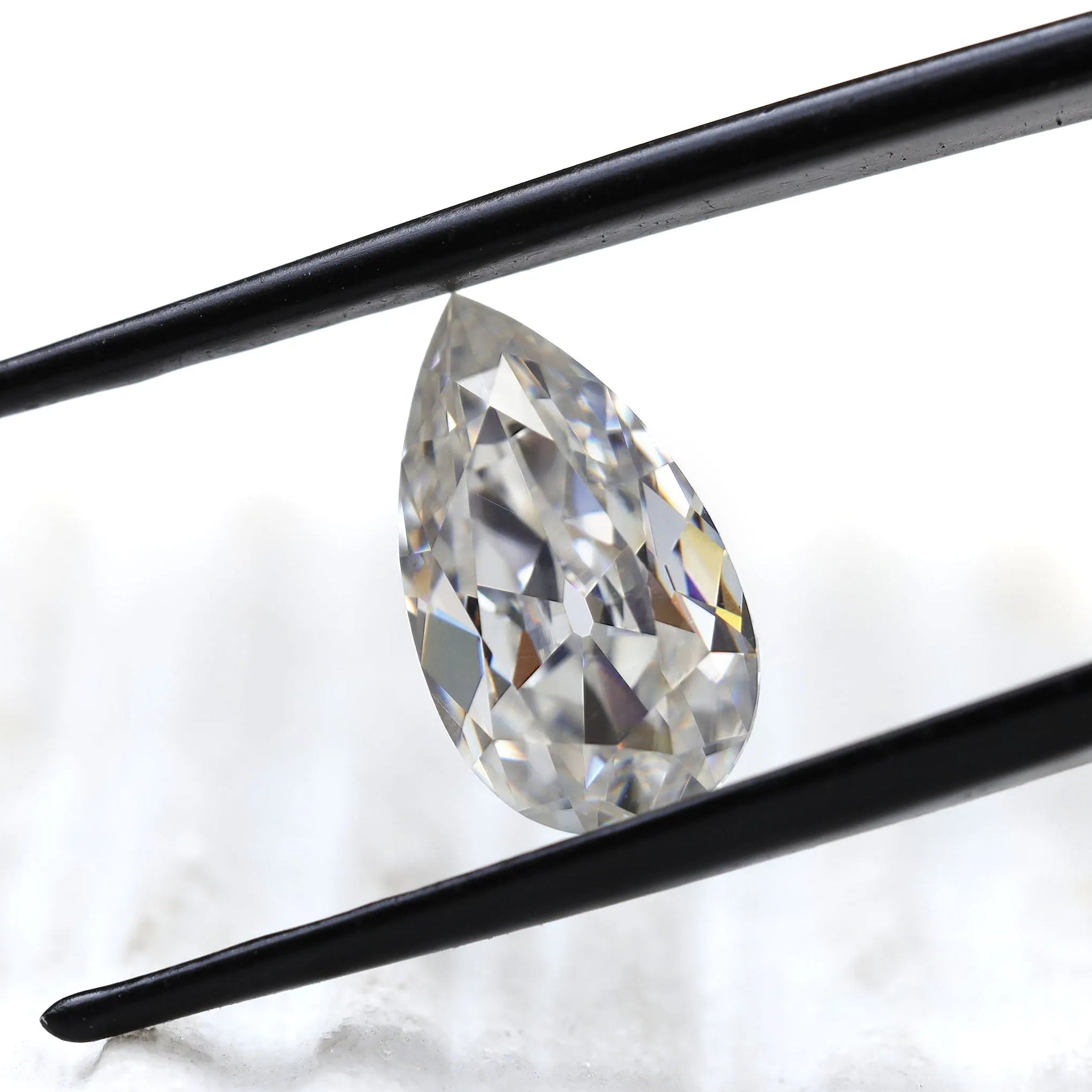 DEF pear moissanite shown at slight side angle