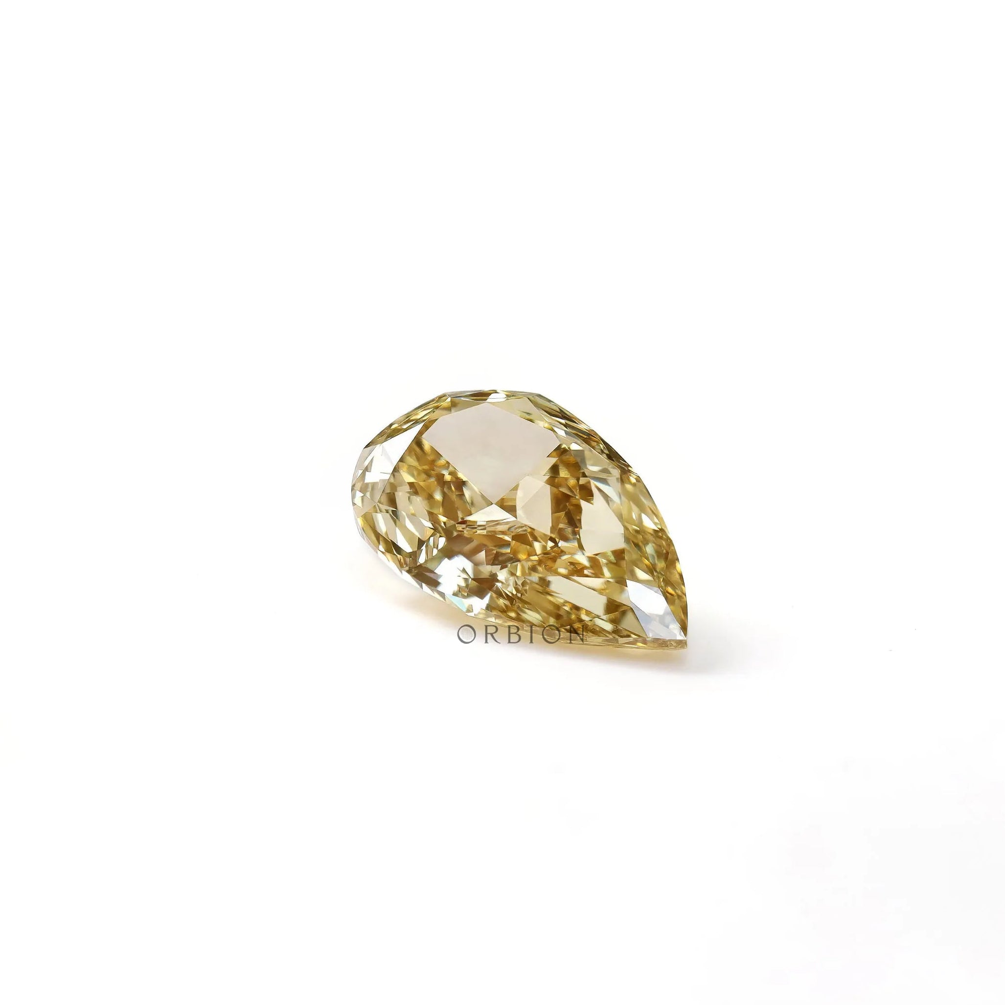 Front profile of pear shaped yellow loose lab diamond on white surface