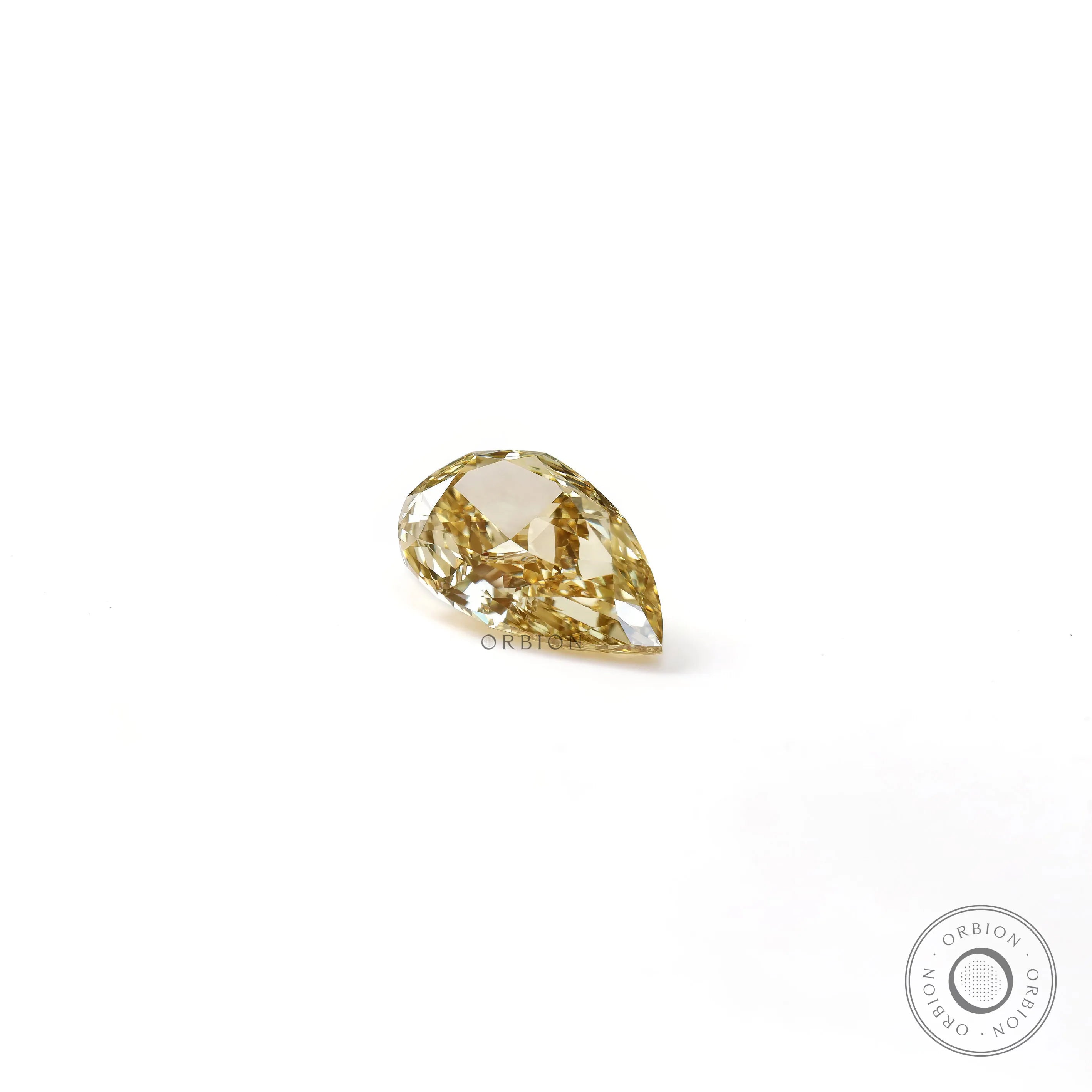 Front profile of pear shaped yellow loose lab diamond on white surface