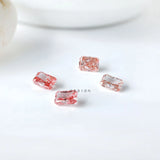 Four pink radiant lab diamonds showing color variation