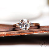 Three Stone Round Trilogy Moissanite Engagement Ring 10k 14k 18k Rose Gold Matte Finish Side Tapered Baguettes Cathedral Ring