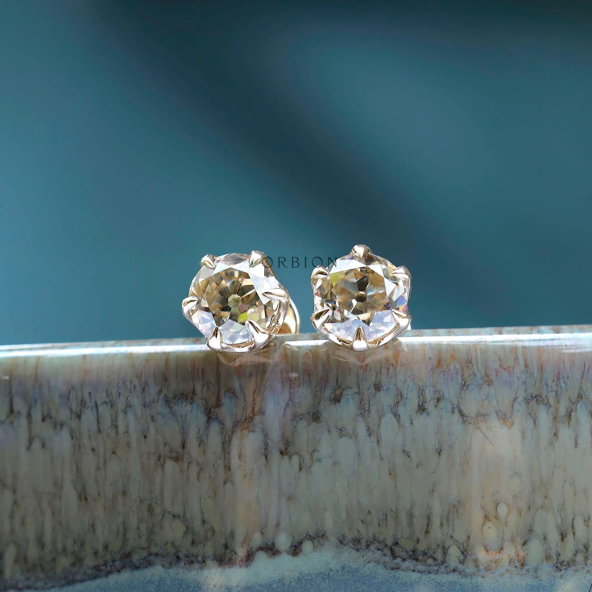 Display edge view OEC champagne moissanite stud earrings