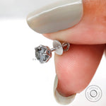 Handheld angled view detail grey moissanite claw prong stud