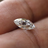 Elegant marquise moissanite stone held between fingers