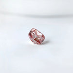 Side angled profile of purplish pink cushion loose lab diamond