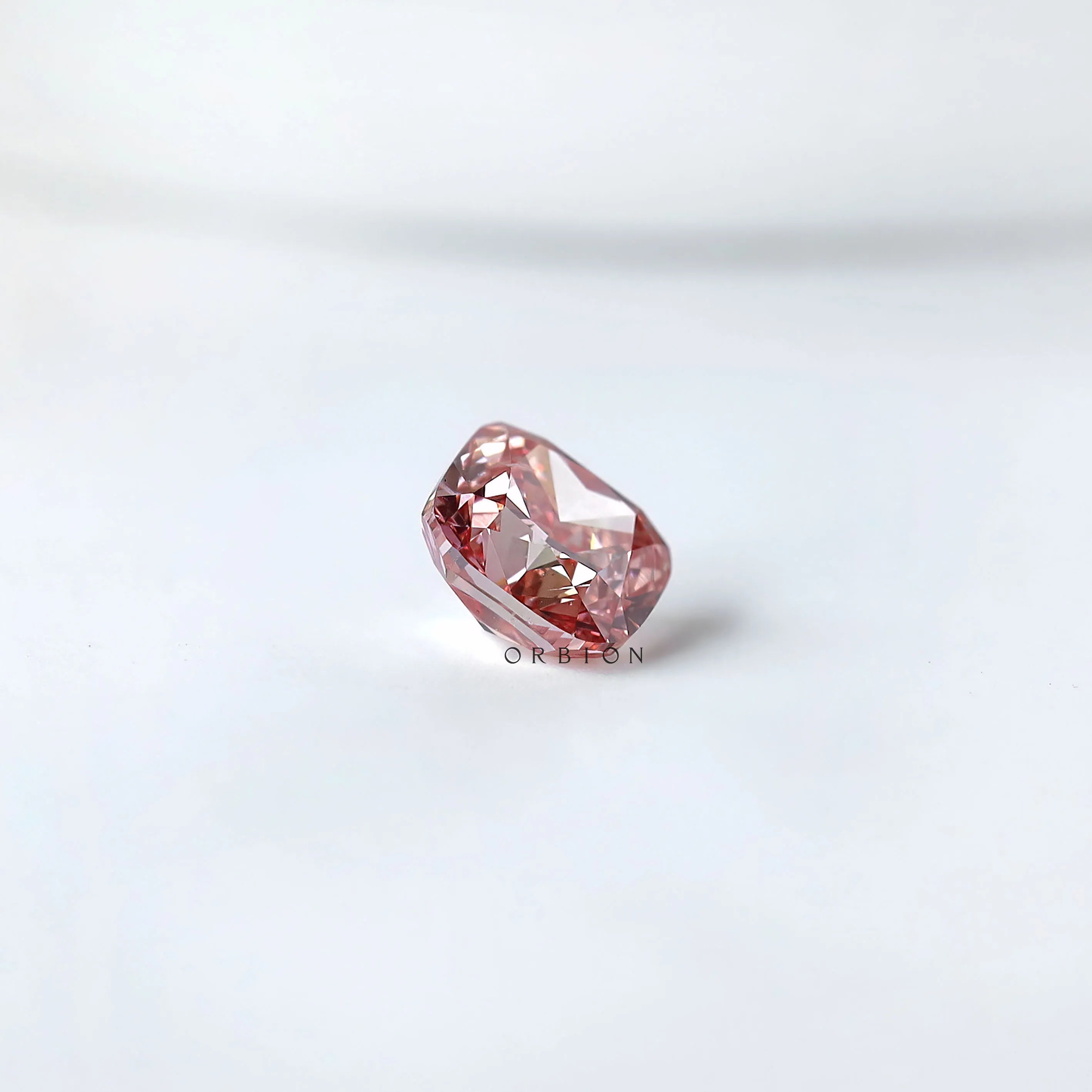 Side angled profile of purplish pink cushion loose lab diamond
