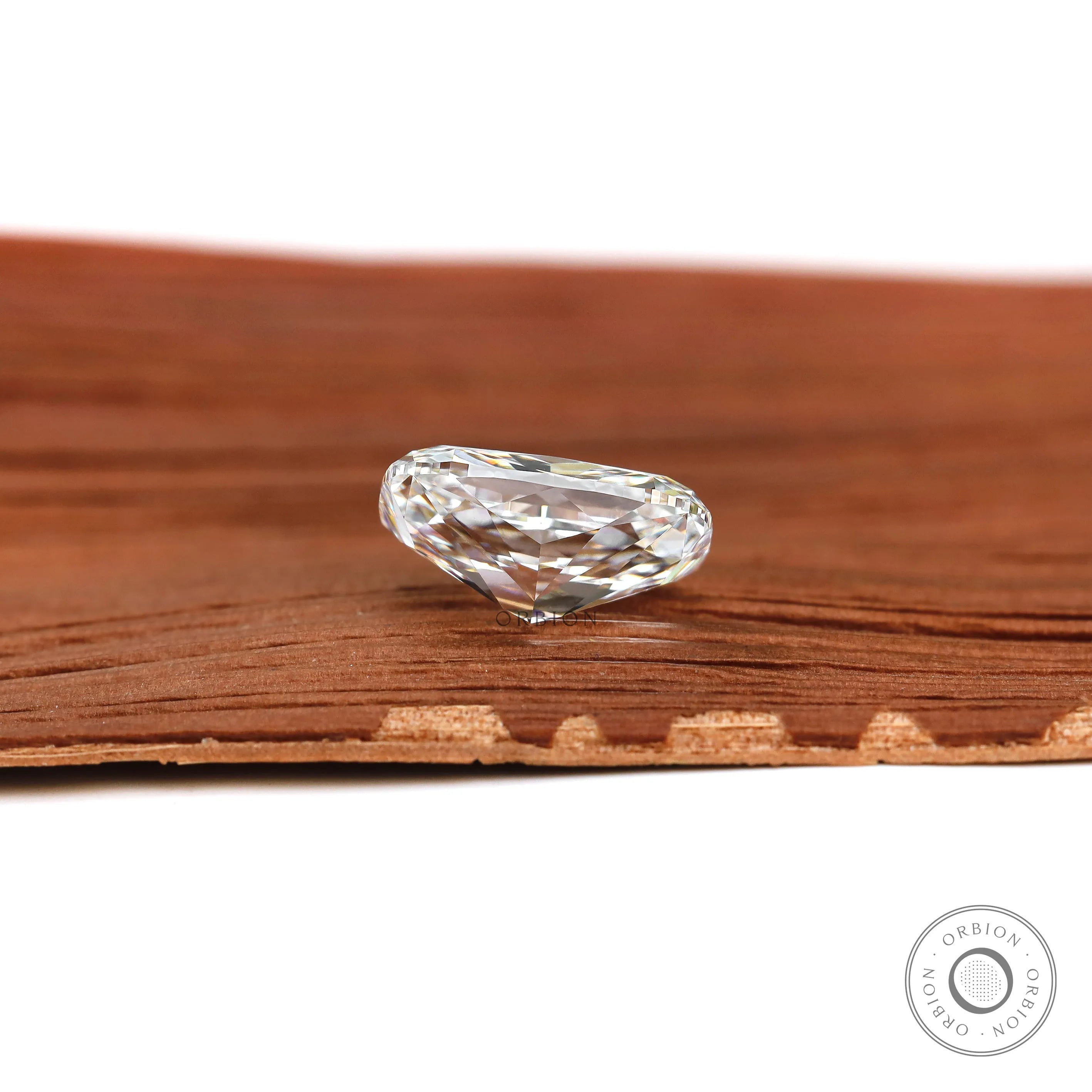 Side profile elongated cushion brilliant cut lab diamond on wood