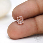 Fancy pink elongated cushion loose diamond on fingertip display