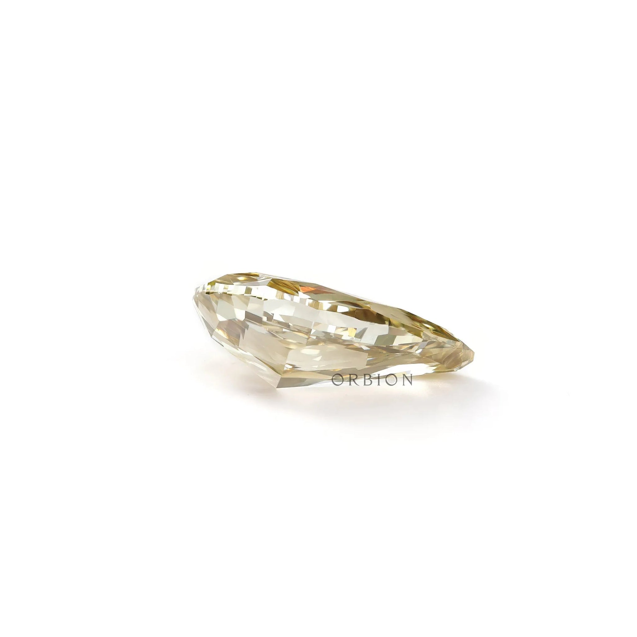 Bottom profile of pear shaped yellow loose lab diamond on white surface