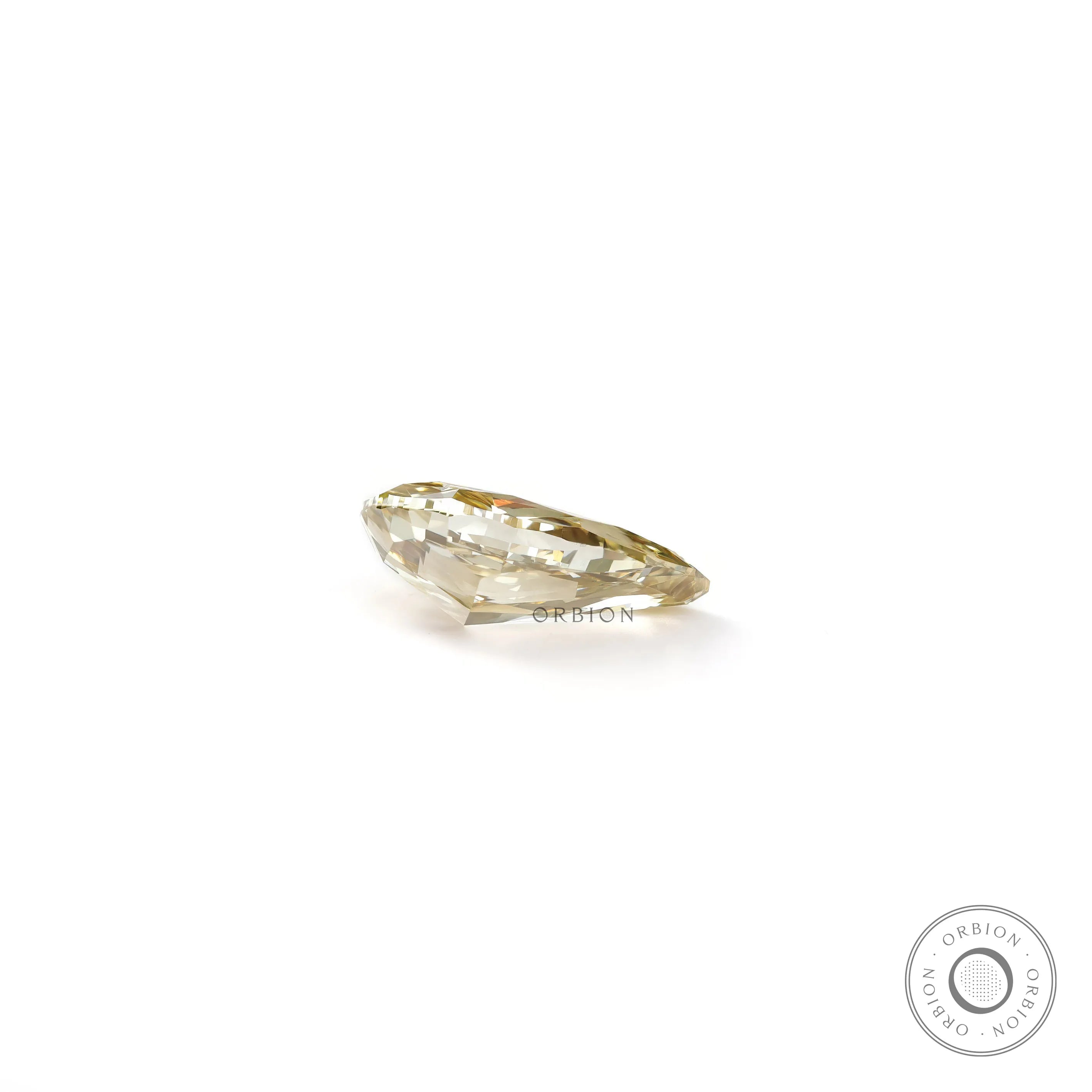 Bottom profile of pear shaped yellow loose lab diamond on white surface