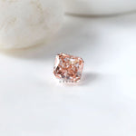 Radiant brilliant pink loose diamond with soft white background