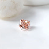 Radiant brilliant pink loose diamond with soft white background