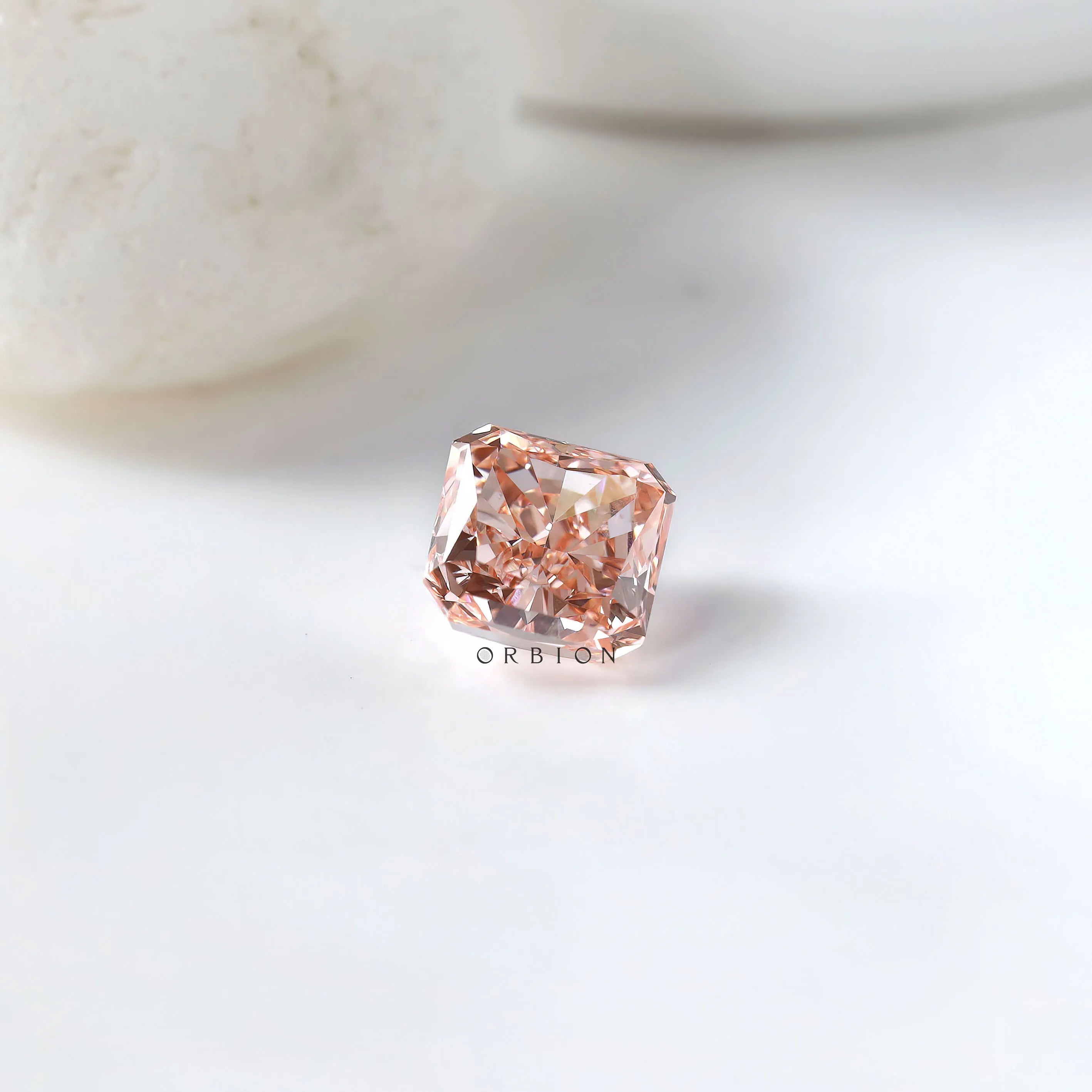 Radiant brilliant pink loose diamond with soft white background