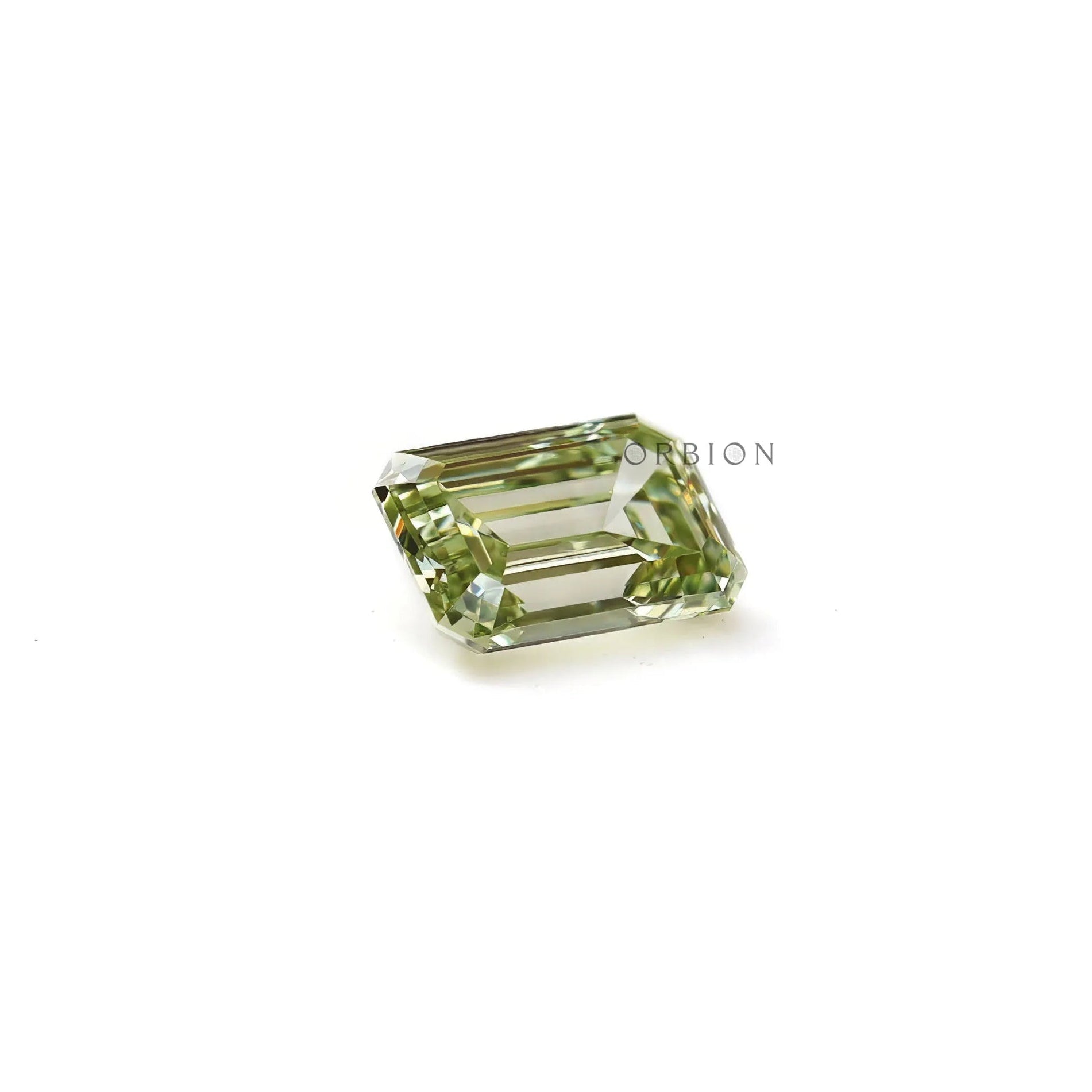 Emerald cut fancy green loose diamond resting flat